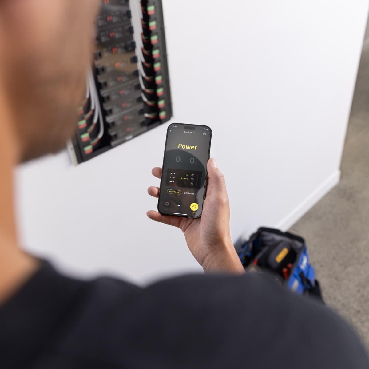 The Basis Trade app open on a phone next to a Basis Board